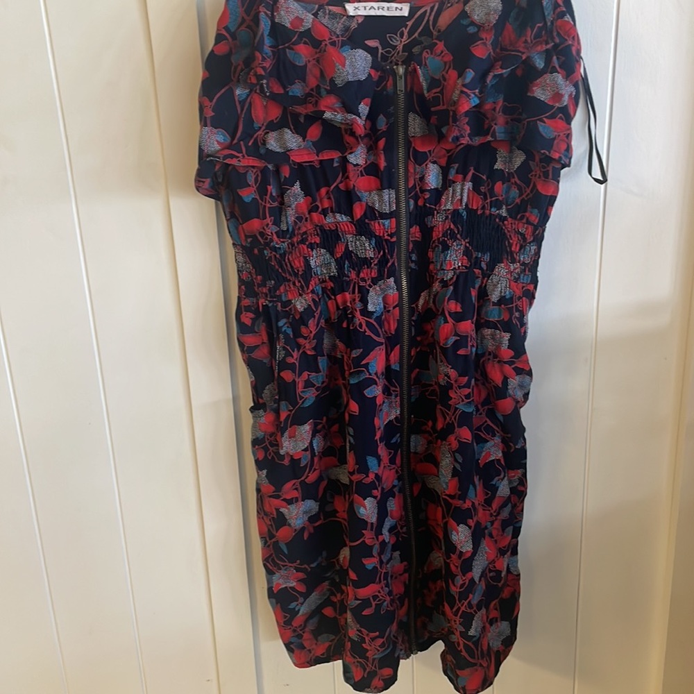 Xtaren dress. The dress has some threads hanging on the shoulders.